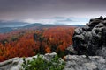 Rocky landscape during autumn. Beautiful landscape with stone, forest and fog. Sunset in czech national park Ceske Svycarsko. Mist Royalty Free Stock Photo