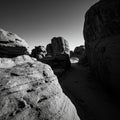 Rocky landscape in black and white, featuring large rock formations with smooth, Royalty Free Stock Photo