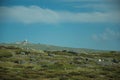 Rocky landscape with bushes and domes of an old radar station Royalty Free Stock Photo