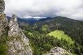 Rocky landscape in the mountains. Travel adventure hikking scenery in the summer. Greeen valley with a wild forest