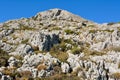 Rocky landscape topped by ruins of fortified castle located on t Royalty Free Stock Photo