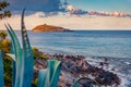 Rocky morning view of Mediterranean coast with Cirella island from Cirella beach.