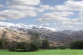 Rocky mountain and fields countryside snow scene Royalty Free Stock Photo