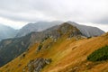 Rocky mountain landscape, in the distance people hiking along th