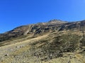 Rocky mountain peak Piz Murterchoembel (2998 m) in the massif of the Albula Alps above the Swiss road pass Fluela Royalty Free Stock Photo