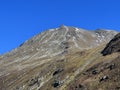 Rocky mountain peak Piz Murterchoembel (2998 m) in the massif of the Albula Alps above the Swiss road pass Fluela Royalty Free Stock Photo