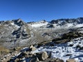 Rocky mountain peaks Piz Sarsura Pitschen (3132 m), Piz Sarsura (3176 m) and Grippa Naira (3130 m) Royalty Free Stock Photo