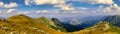 Rocky Mountain Peaks under Blue Sky with White Clouds panoramic Royalty Free Stock Photo