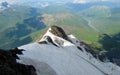 Rocky mountain range above green valley