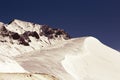 Rocky mountain range covered with snow. Retro toning