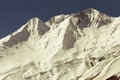 Rocky mountain range covered with snow. Retro toning