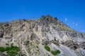 Rocky mountain ridge and peak against a sunny blue sky, Yellowstone National Park, USA Royalty Free Stock Photo