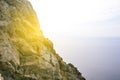 Rocky mountain and seascape. View from the mountain and sunlight. Traveling in the mountains. Mountain tourism Royalty Free Stock Photo