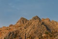 Rocky mountain during sunset with a cross and the texture of Sinyukha stones in Kolyvan