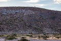 Rocky mountainous hill with cacti, steppes, scrubland, wild plants and junipers