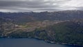 Rocky mountains along a fjord with snow on top Rogaland, Norway