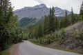 Rocky Mountains. asphalt mountain road on a sunny day. Road with yellow markings. Empty highway in Journey Royalty Free Stock Photo