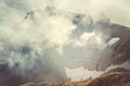 Rocky Mountains with clouds and hikers silhouette beyond