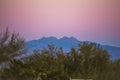 Rocky Mountains Under a Pink Sunset Sky Royalty Free Stock Photo