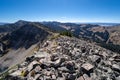 Rocky narrow dangerous ridge of talus scree rocks on top of mountain trail