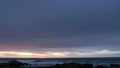 Rocky ocean coast sea waves, Monterey beach California, birds flying, sunset sky Royalty Free Stock Photo