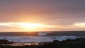 Rocky ocean coast sea waves, Monterey beach California, birds flying, sunset sky Royalty Free Stock Photo