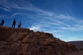 People admiring the Grand Canyon on top of the peak