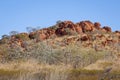 A rocky outcrop of eroded rock rising out of the Australian bush Royalty Free Stock Photo