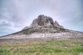 The rocky outcrop is located in the Upper Cretaceous