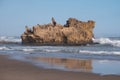 Rocks on the sandy beach at Brenton on Sea, Knysna, photographed at sundown, South Africa. Royalty Free Stock Photo