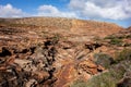 Rocky path in a dry trough of a creek leading to Pot Alley Beach in Kalbarri National Park, Western Australia Royalty Free Stock Photo