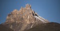 Rocky peak in the mountains with cliffs and rocky slopes with snow Royalty Free Stock Photo