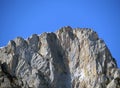 Rocky peak Mutteristock 2295 m in the in the Schwyz Prealps mountain range, and over the WÃÂ¤gitalersee reservoir lake