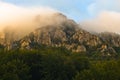 Rocky peaks at foggy sunrise, trekking path at Suva Planina mountain Royalty Free Stock Photo