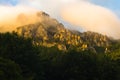 Rocky peaks at foggy sunrise, trekking path at Suva Planina mountain Royalty Free Stock Photo