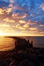 Rocky pier, sunrise, cloudscape Royalty Free Stock Photo