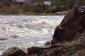 Rocky riverbank and splashing river Royalty Free Stock Photo