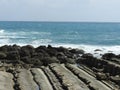 The rocky road leading to the sea, the former way blue sea and sky.