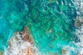 Rocky sandy beach with beautiful emerald water of Mediterranean Sea. Background top view Royalty Free Stock Photo