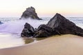 Rocky and sandy beach at sunrise, Portugal Royalty Free Stock Photo