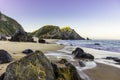 Rocky and sandy beach at sunrise, Portugal Royalty Free Stock Photo