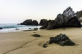 Rocky and sandy beach at sunrise, Portugal Royalty Free Stock Photo