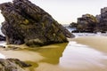 Rocky and sandy beach at sunrise, Portugal Royalty Free Stock Photo