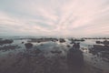 Rocky sea beach with wide angle perspective Royalty Free Stock Photo