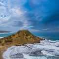 sea cape at the storm under dark cloudy sky