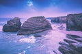 Rocky sea coast at sunrise. Beach Playa de Las Catedrales Royalty Free Stock Photo