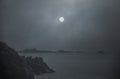 Foggy full moon in the sea Royalty Free Stock Photo