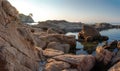 Rocky seascape in Lloret de Mar, Spain. Costa Brava coast. Sea beach in Mediterranean sea. Sunrise in Spanish seaside with rocks