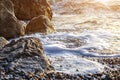 Rocky seashore and foamy sea Royalty Free Stock Photo