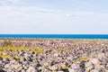 Rocky seashore. Huge rounded boulders on the beach.